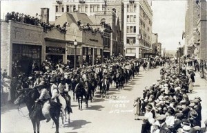 Rodeo on Main Street? This 1923 Calgary Stampede parade of mounted cowboys may have been many of that year's contestants. (Photo credit: Calgary Stampede Archives, Wikimedia Commons)