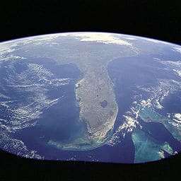 This1998  image from space shows a Florida surrounded by blue waters. Pollution may darken that seascape image soon. (Photo credit: NASA, Wikimedia Commons)