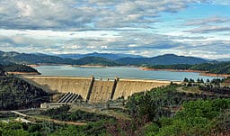 Shasta Dam in 2009. A plan to raise the dam's water level will wipe out Native American land. (Photo credit: Apaliwal, Wikimedia Commons)